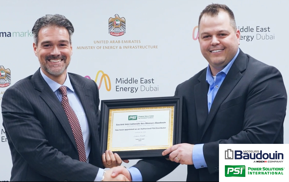 Two men shaking hands holding a certificate.